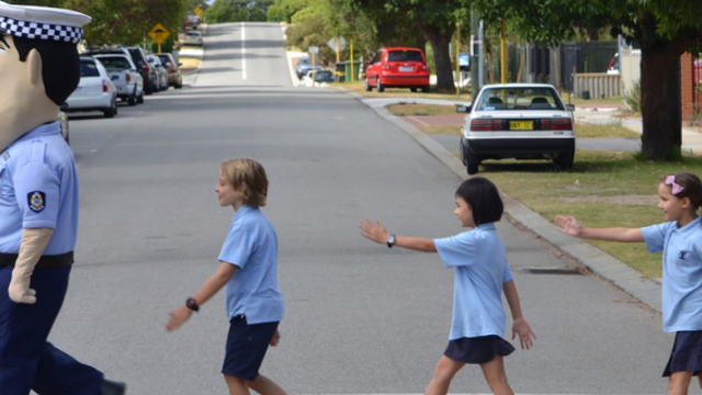 children crossing the road with constable care